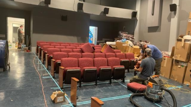 New theatre seats being positioned just right.